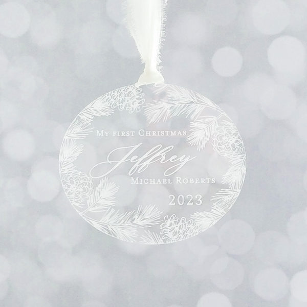 baby's first Christmas ornament with pine cones and pine branches detail - clear engraved acrylic