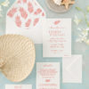 modern tropical wedding invitation with a palm leaf pattern