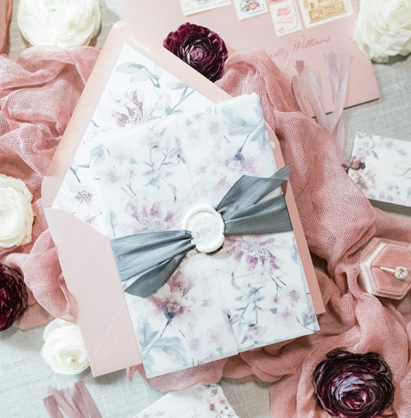 grey and mauve wedding invitation with wax seal and silk ribbon